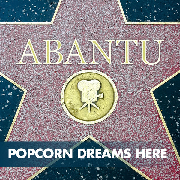 Abantu preps the popcorn bowls to celebrate 25 years of impact on Hollywood